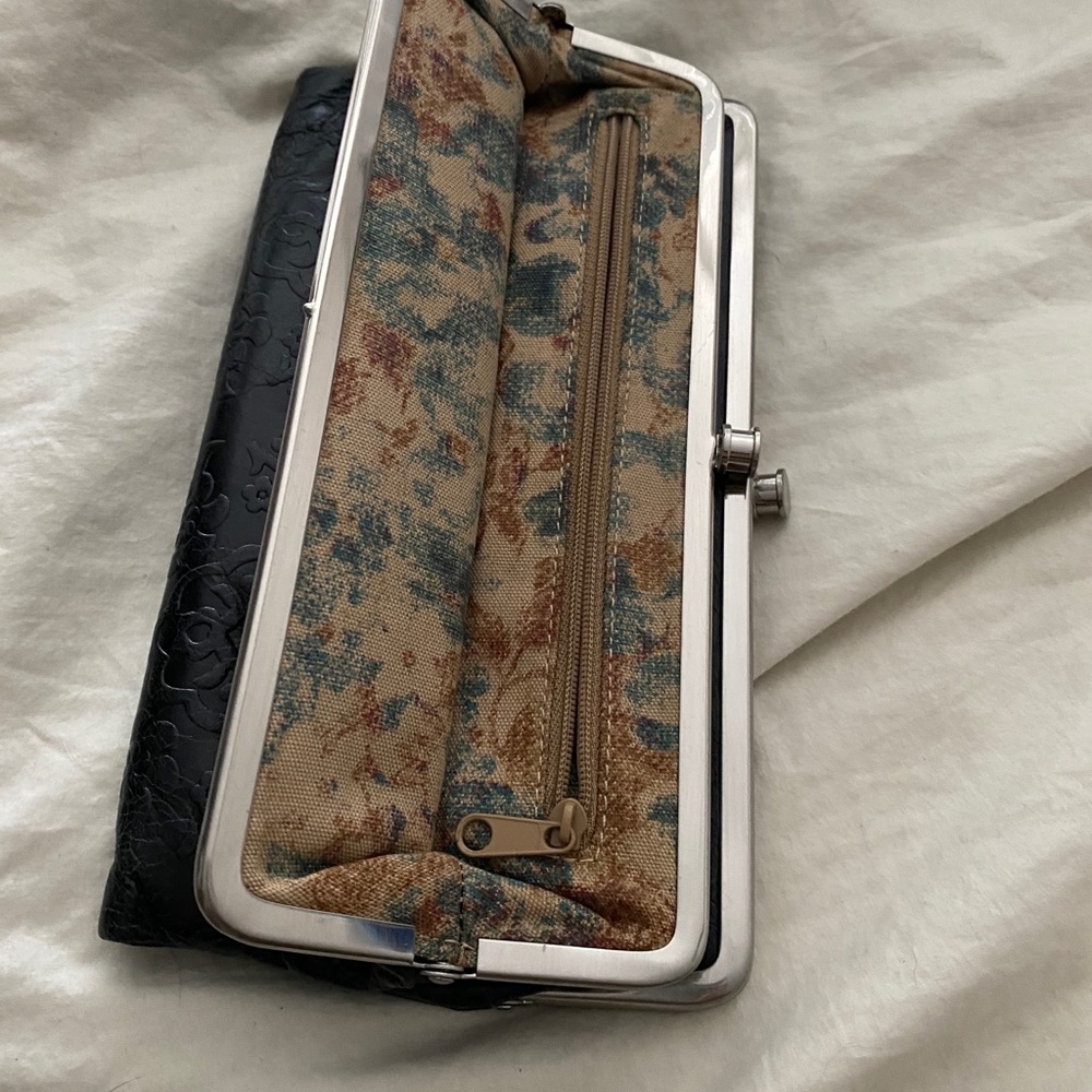 Black clutch w/ silver accent & paisly lining